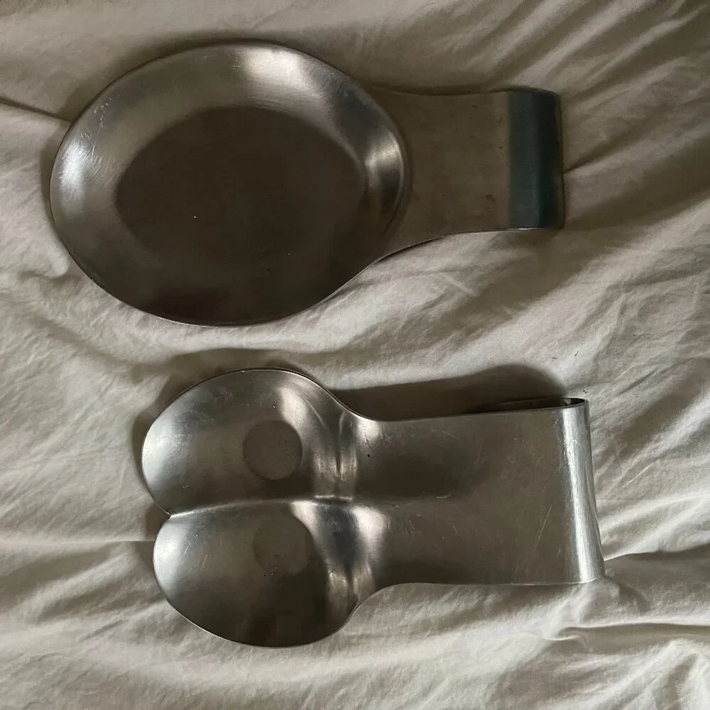two stainless steel spoon rests